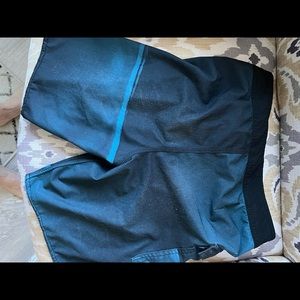 Teens adult swim trunks. Light and dark blue size 29